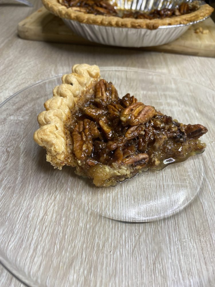 Slice of baked pecan pie