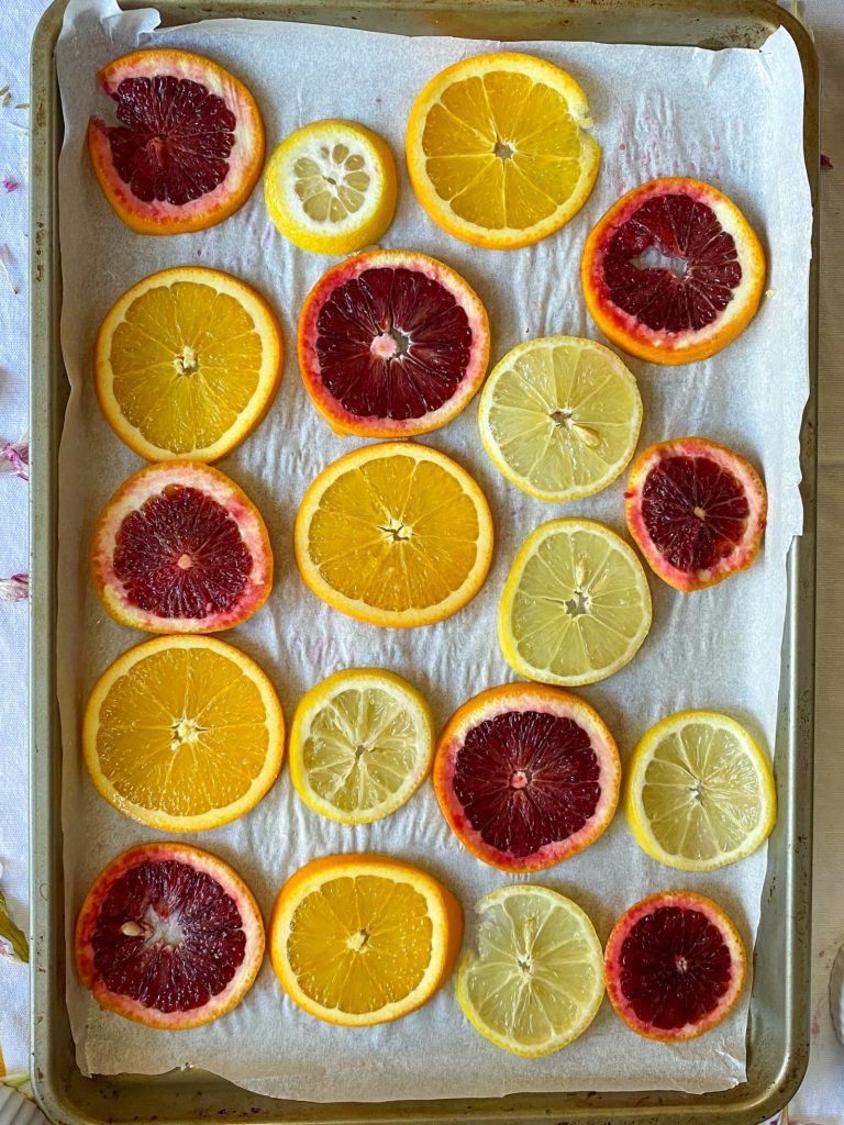 Fresh citrus slices on baking sheet